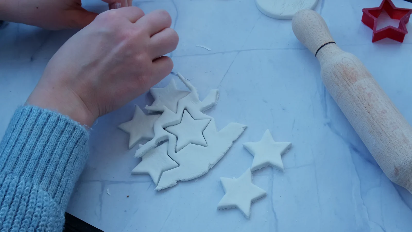 Surrounding clay pulled away from several star shapes.